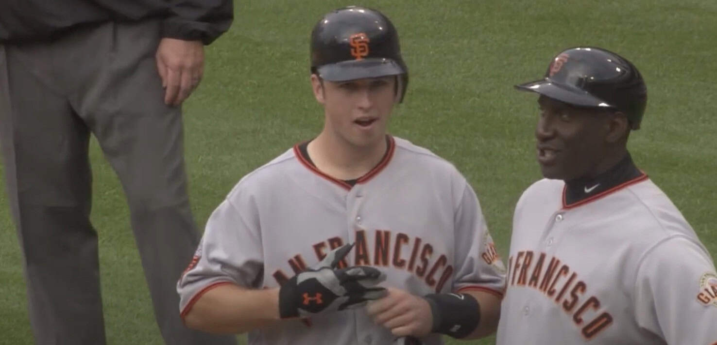 Buster Posey, a key player in the 2010s, celebrates his championship catcher's role.